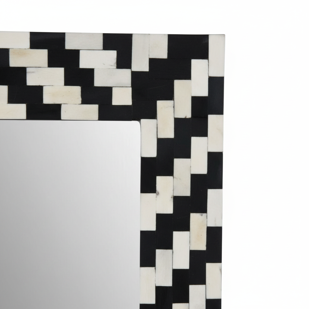 Close-up corner detail of black and white bone inlay accent mirror frame showing intricate camel bone inlay pattern